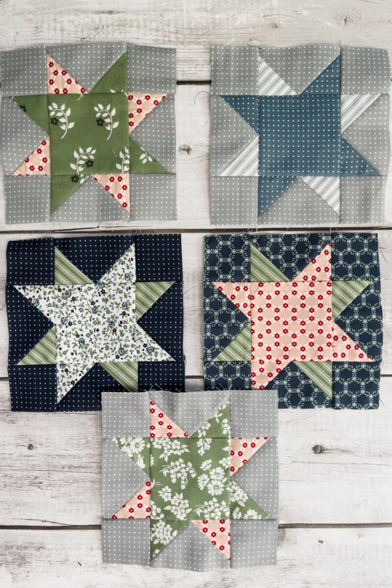 5 eight point star fabrics made with grey or blue background fabrics. Star colors are a variety of blue green and pink fabrics.