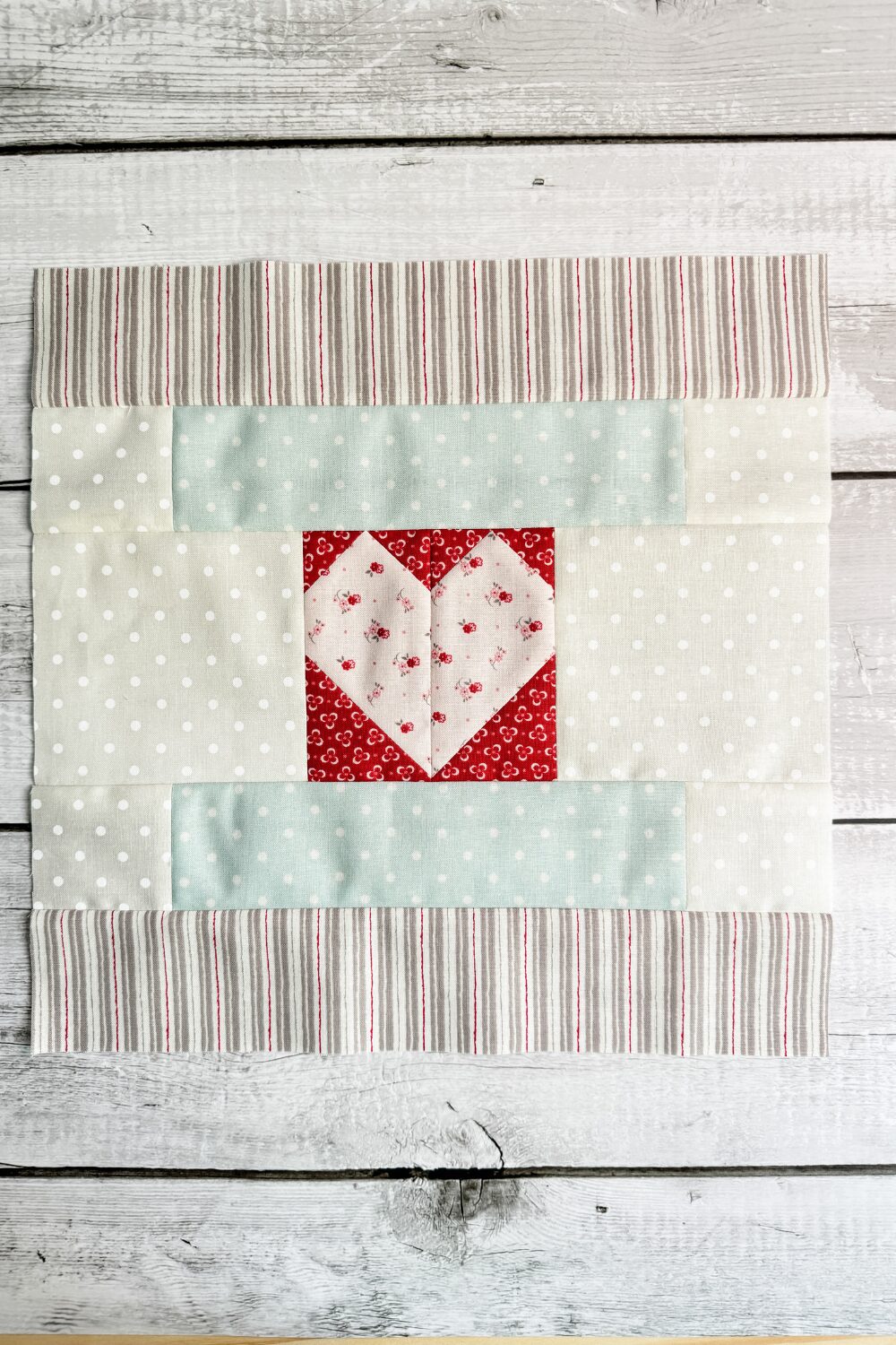 The Pieceful Heart quilt block designed by Anne Sutton of Bunny House Designs