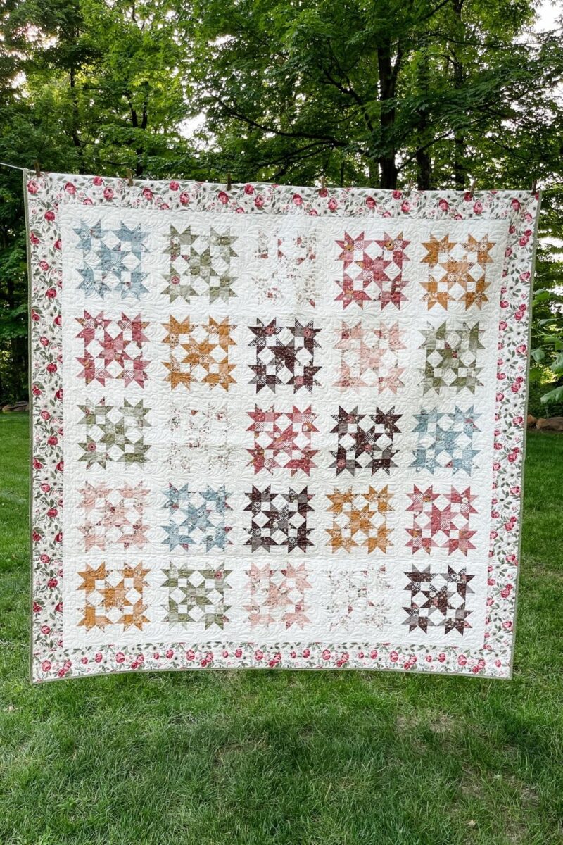 Fully finished Bonnie's Beehive quilt made with a controlled scrappy look of leftover fat quarters from another quilt project