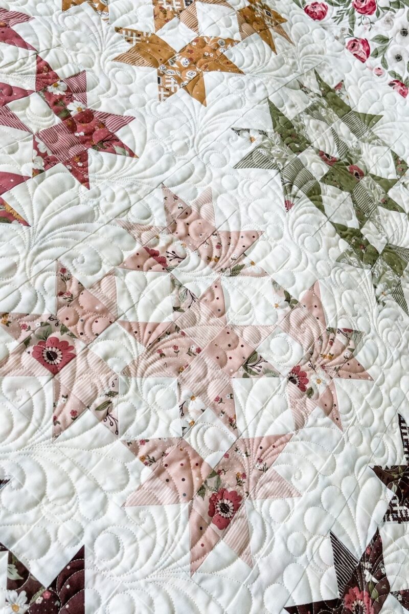 Close up of the Fast Feathers edge to edge pantograph on the quilt