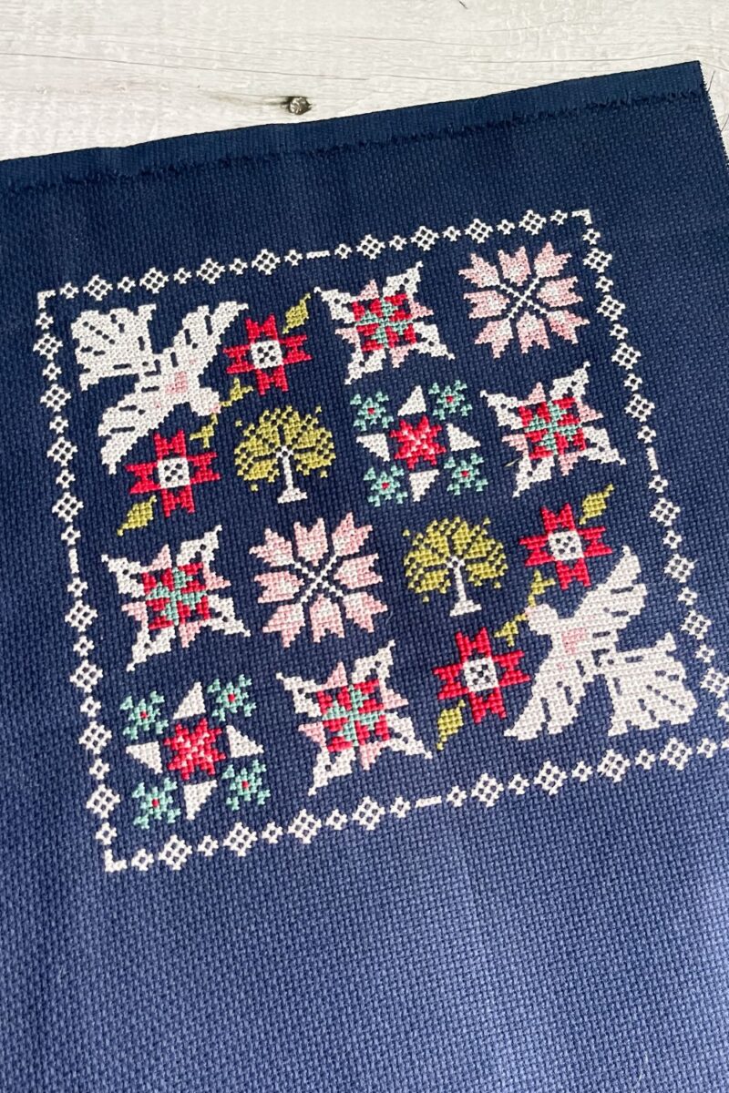 Moonbeams cross stitch completed on 14 count Navy Aida fabric