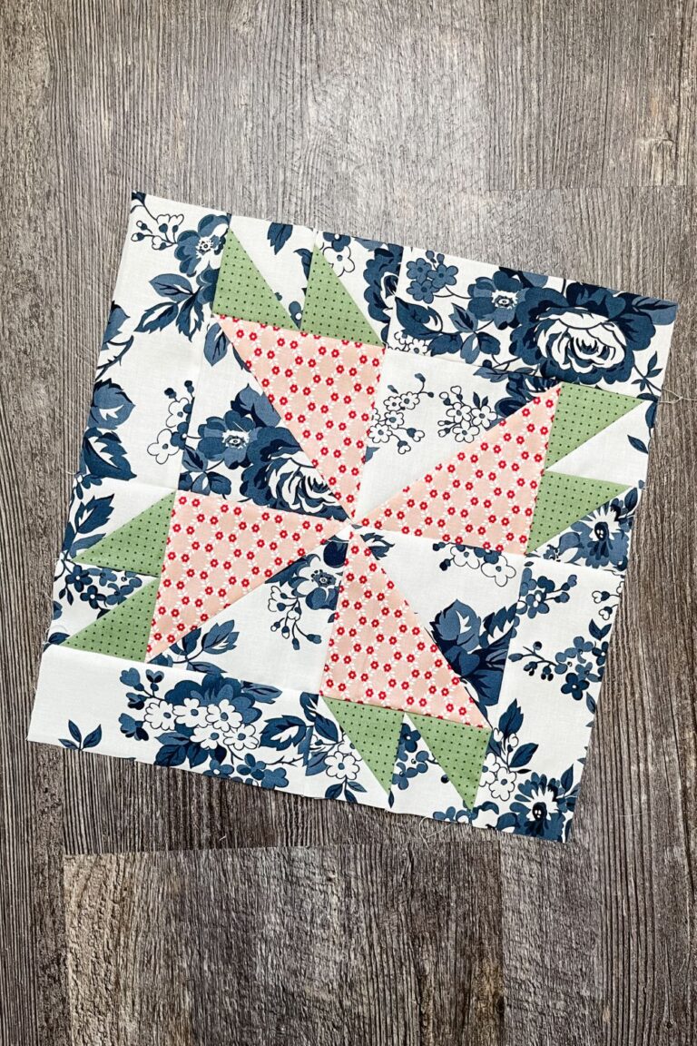 12" Rosebud quilt block in blue floral print from Dwell fabric collection.