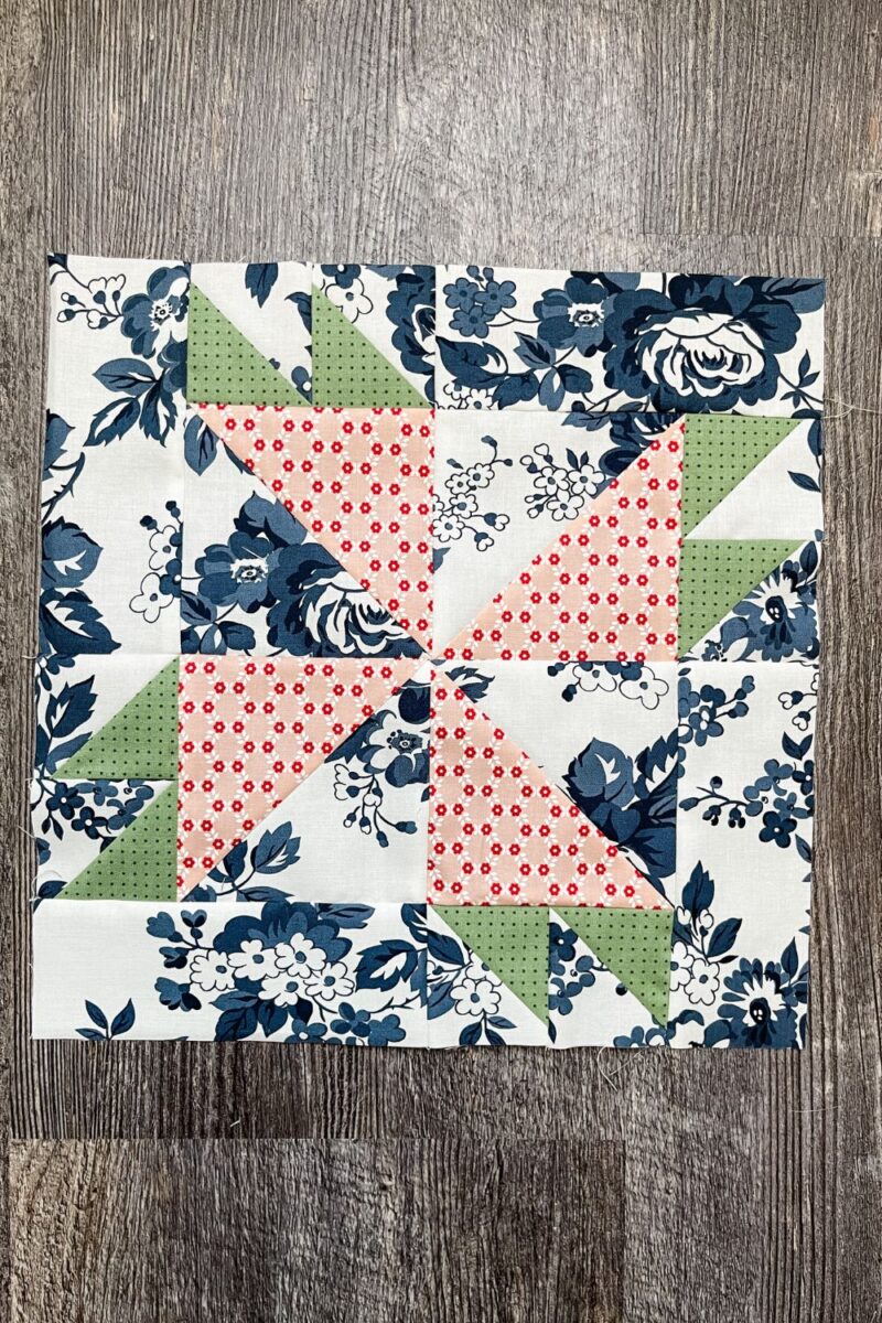 12" Rosebud quilt block in blue floral print from Dwell fabric collection.