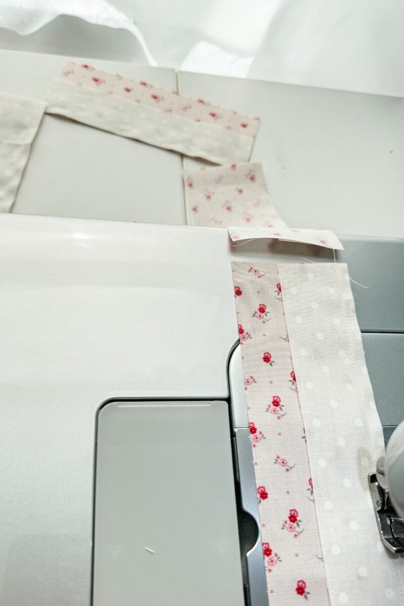 Chain piecing parts of a quilt block end to end without cutting the thread in between the sections.