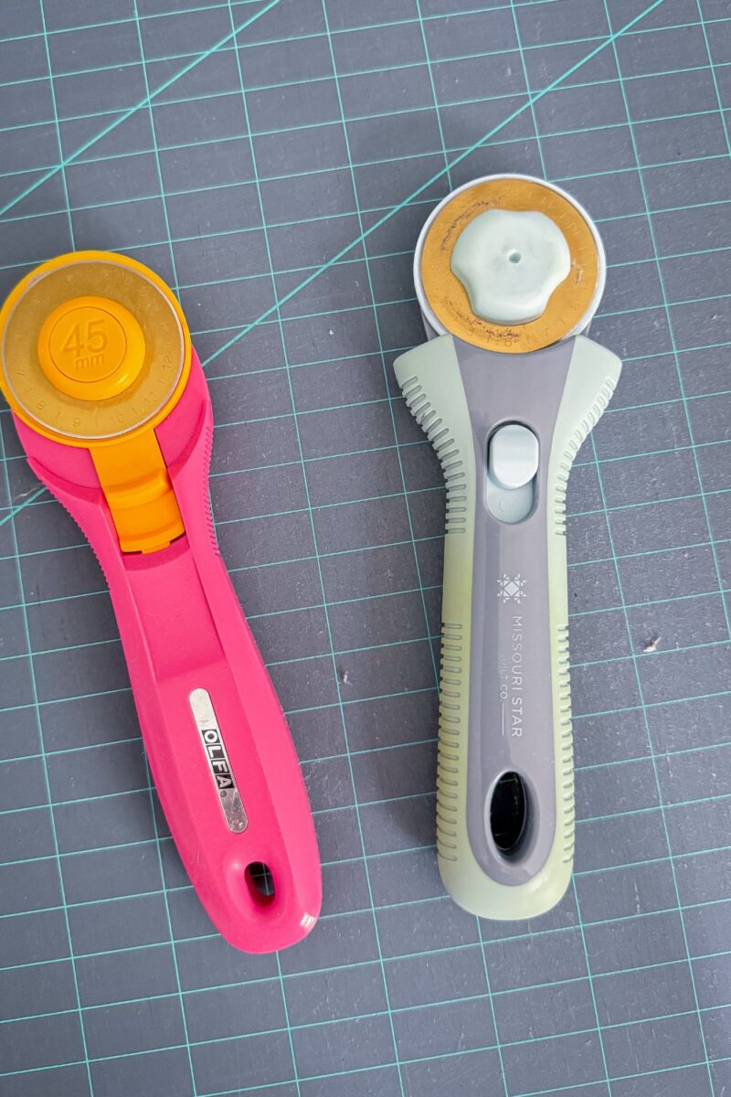 Two rotary cutter styles, one Olfa Splash and one Missouri Star ball bearing assisted rotary cutter.