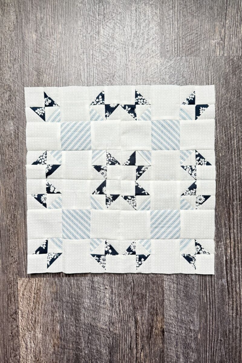 Tulip Lady Fingers Quilt block made with a modified 9 patch quilt block of half square triangle units and square units.