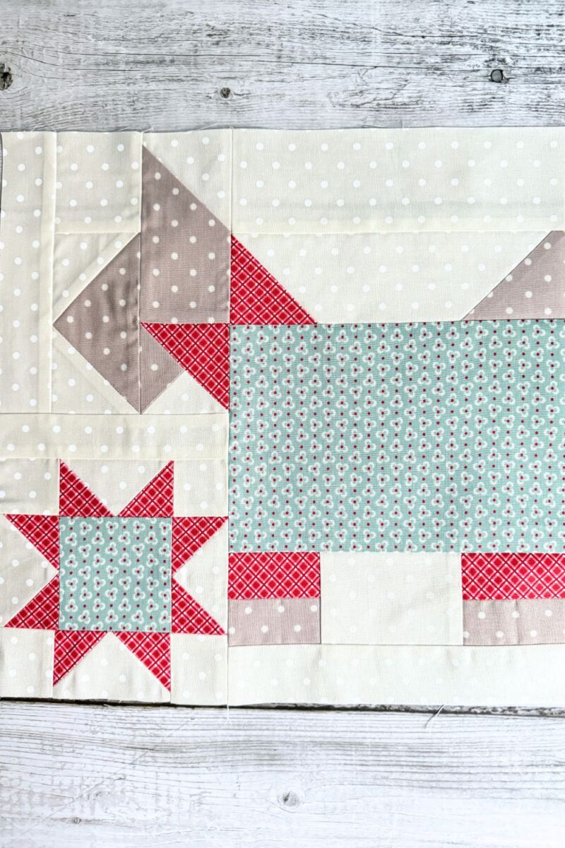 Detail of the 'My Best Friend' quilt block from the Designer Mystery Quilt Along month 5, showcasing a Scottie dog with a stylish bow tie and a cheerful star element.