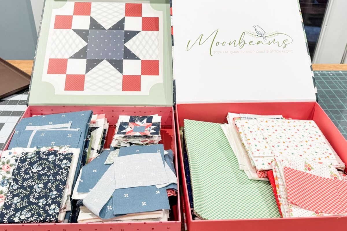 Leftover fabrics in storage boxes from previous quilt alongs Designer Mystery and Moonbeams. The already coordinated fabrics will make a great secondary project for quilting plans in 2025