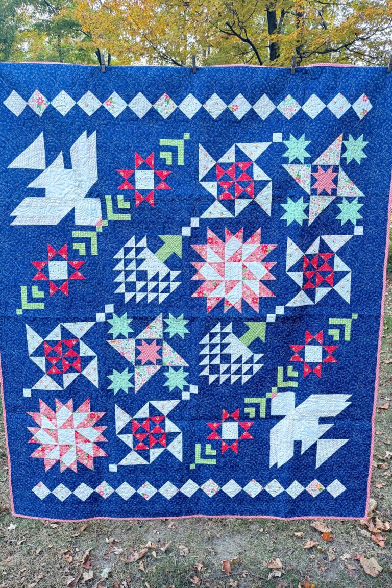 The completed Moonbeams Quilt, measuring 68.5" x 80.5", beautifully photographed to showcase its intricate patterns and bold quilting.