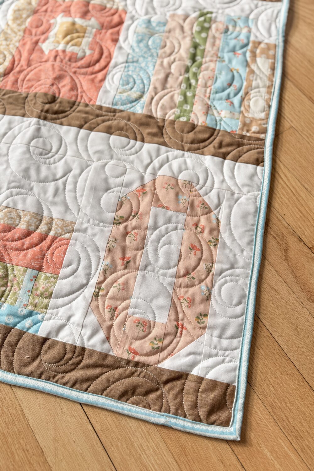 Personalized "O" quilt block in Olivia’s bookshelf quilt.