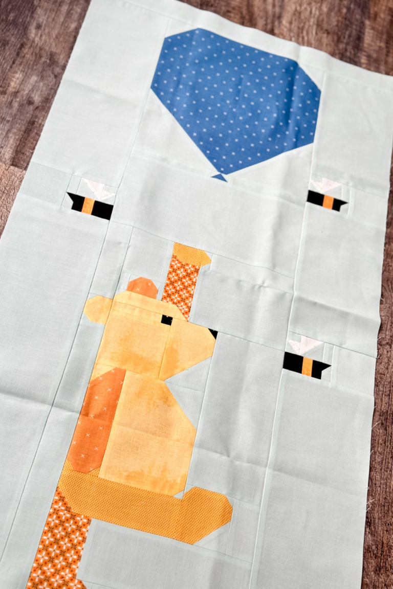 an angled photo of Winnie the Pooh quilt block for the 100 Acre Wood quilt