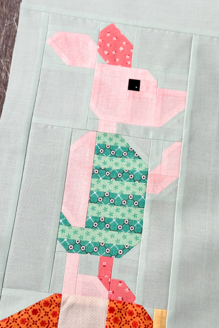 An angled close-up of the Piglet block, highlighting fabric details and Piglet's shirt.