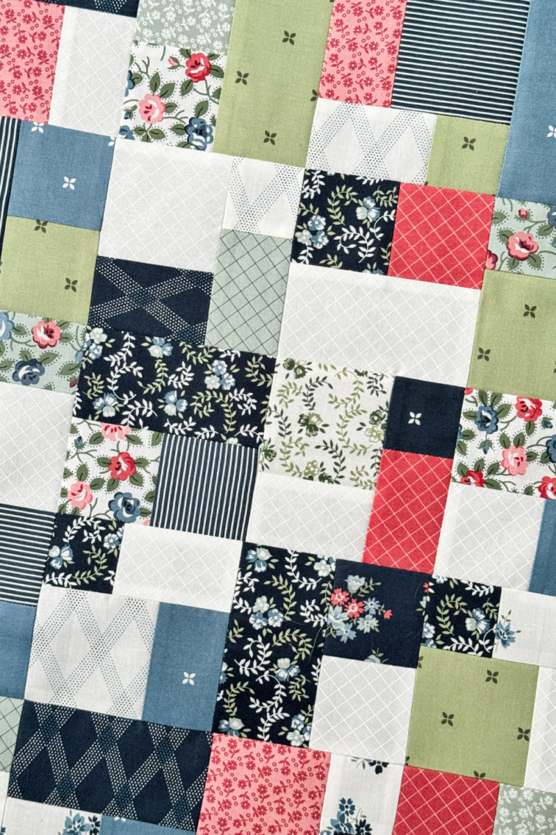 Close-up of pressed quilt seams with fabric pieces neatly aligned for accurate piecing.