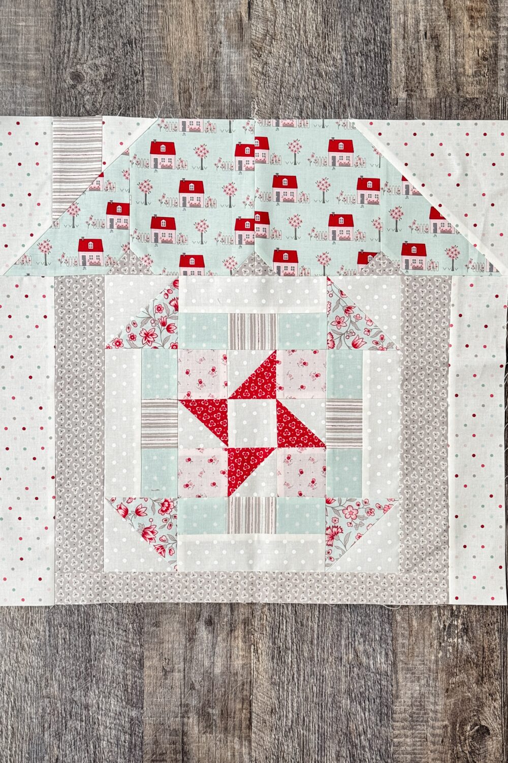 Welcome Home quilt block sewn into house setting as part of quilt top.