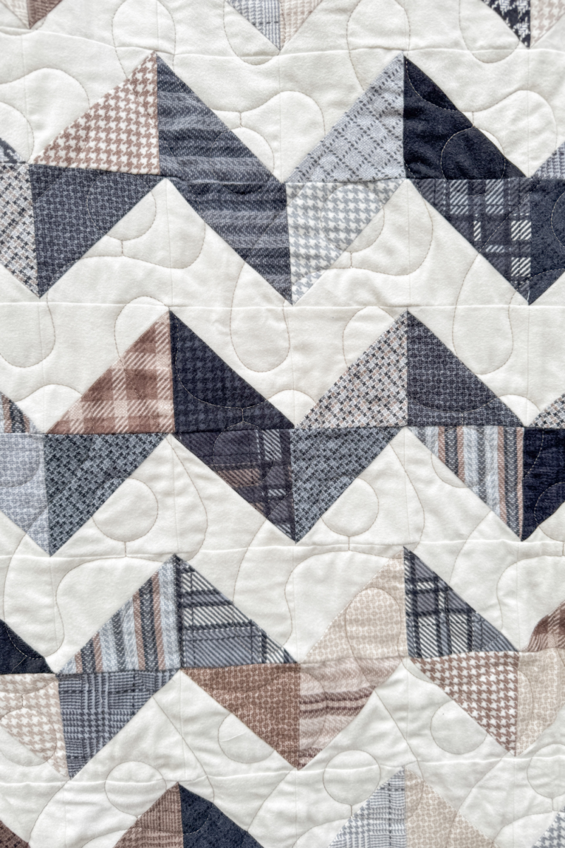 Close-up of Zig Zag Quilt blocks highlighting the zig-zag pattern and cozy flannel textures.