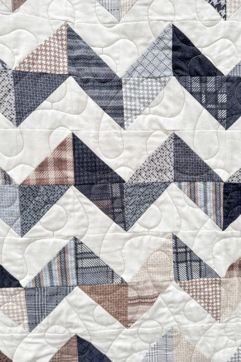 Close-up of Zig Zag Quilt blocks highlighting the zig-zag pattern and cozy flannel textures.
