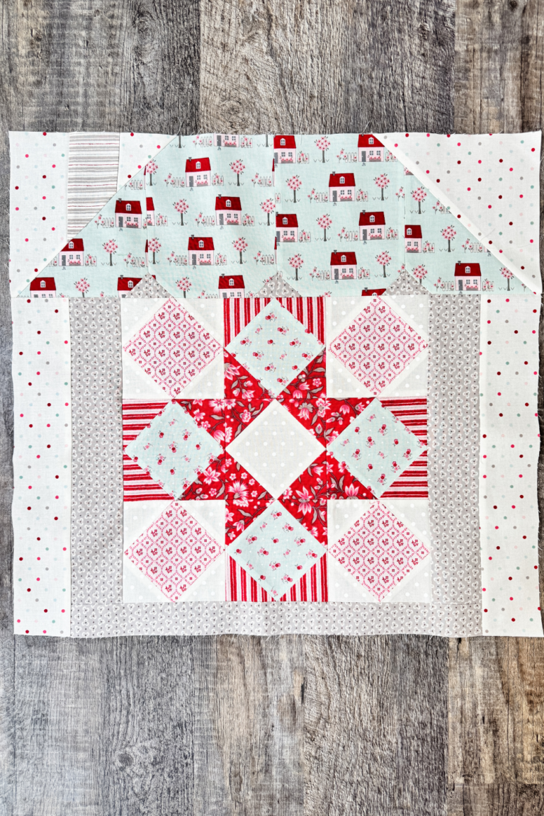 Hugs & Kisses quilt block in house setting ready to be added to the assembled quilt top.