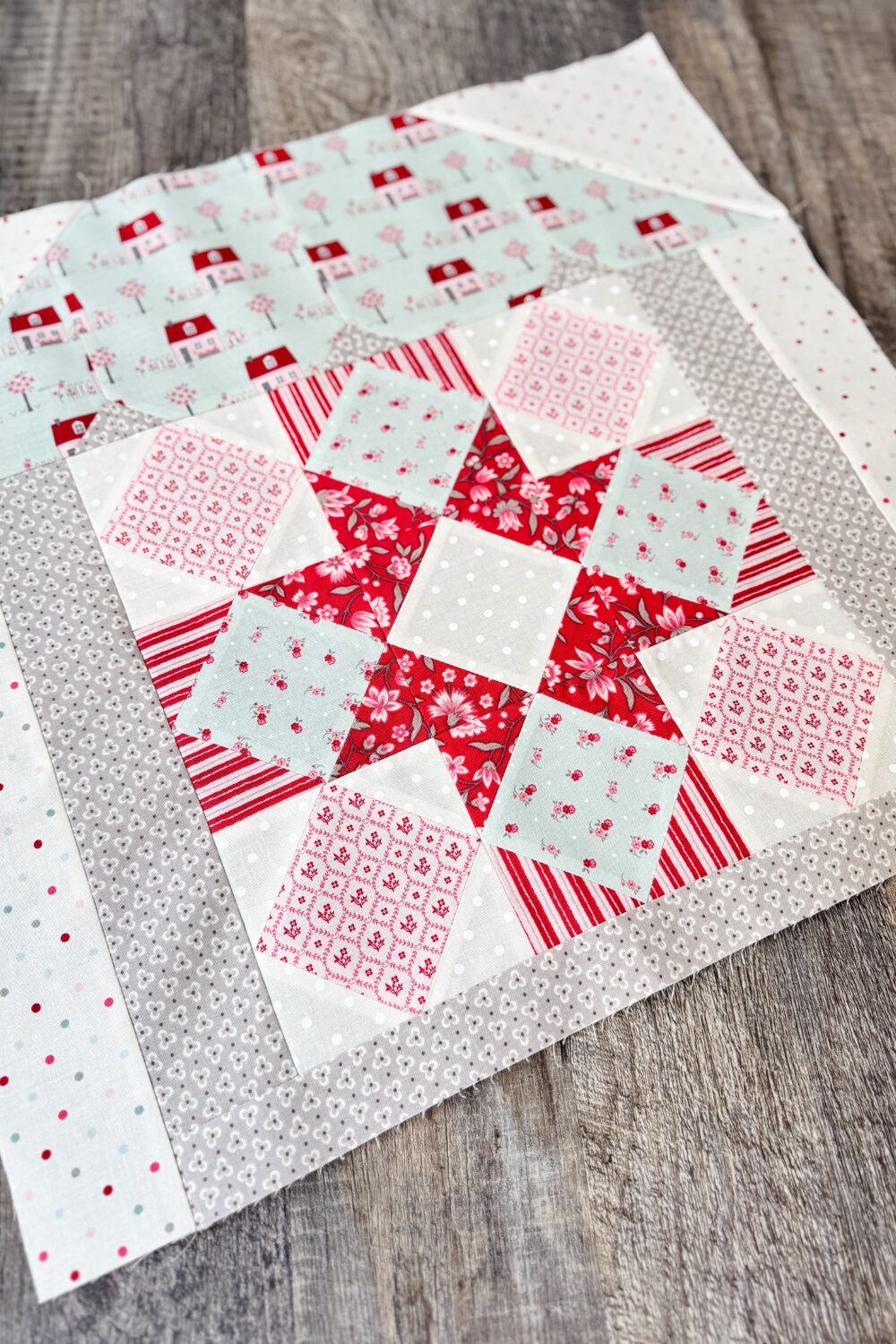 Angled overhead view of the Hugs & Kisses quilt block.