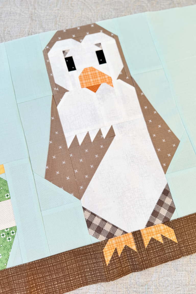 Close-up of Owl quilt block showing Owl’s face, branch, and his eyes where embroidery will be added.