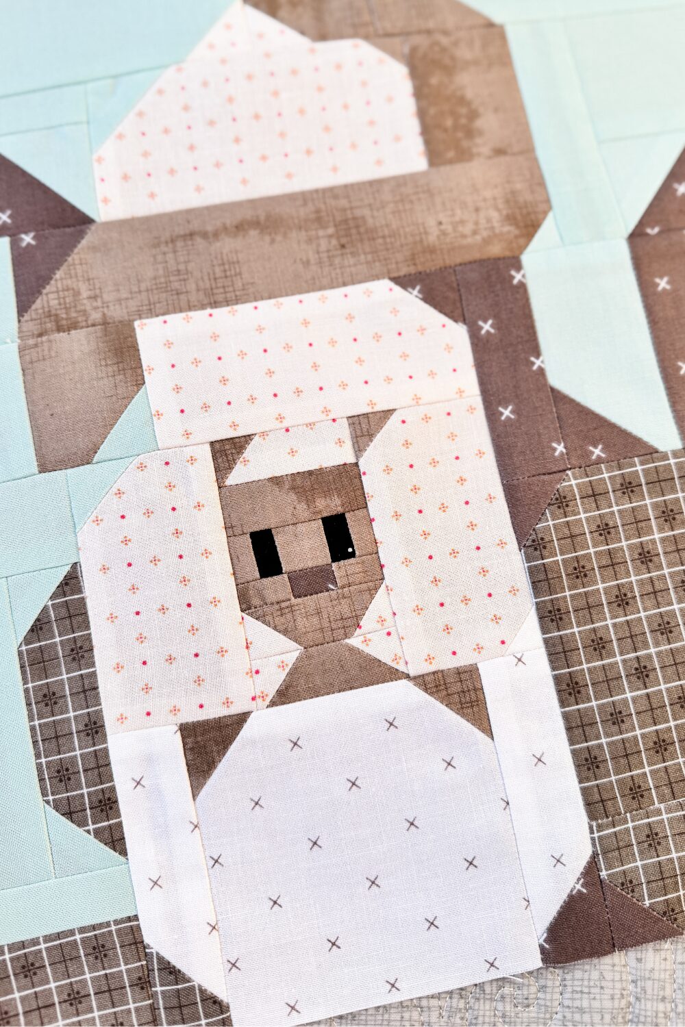 Close-up of Kanga and Roo quilt block highlighting Roo in the pouch and fabric details.