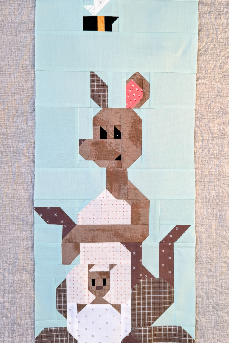 Finished Kanga and Roo quilt block showing Roo in Kanga’s pouch.