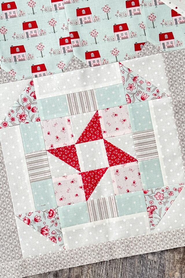 Welcome Home quilt block sewn into house setting as part of quilt top.