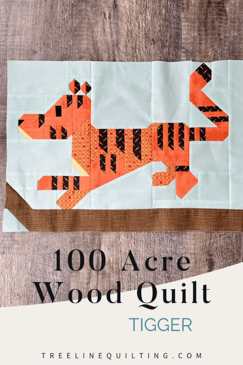 100 Acre Wood Quilt Month 7 – Tigger quilt block with Tigger bouncing on a branch.