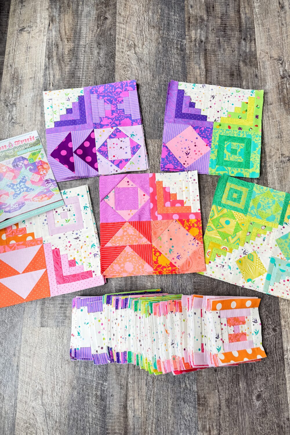 Dragon Fruit Quilt Along blocks alongside scrappy Courthouse Steps blocks made from leftover fabric.