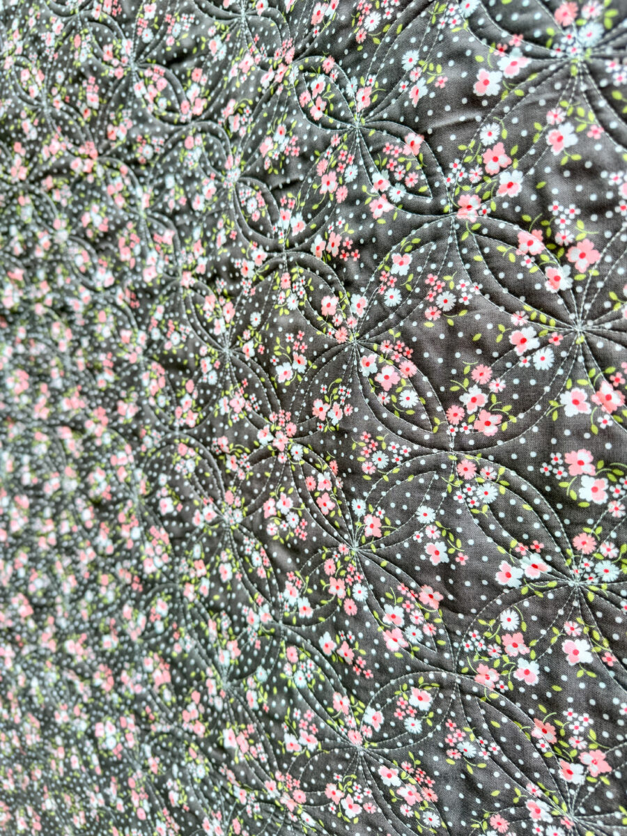 Cali & Co floral fabric used as the quilt back for the Strippy Spools quilt.