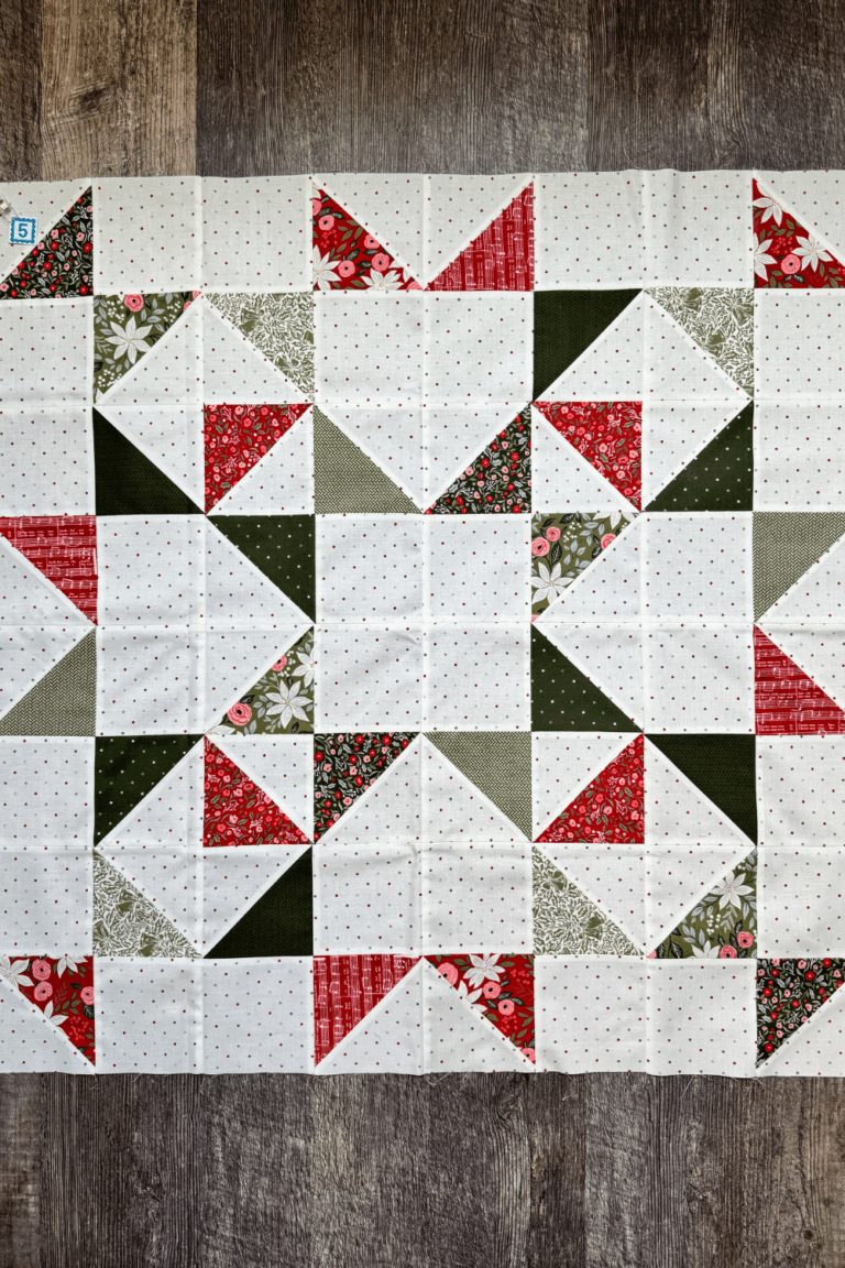 Completed Scatter Stars quilt block from the Jolly Bar 5 book quilt along with Fat Quarter Shop