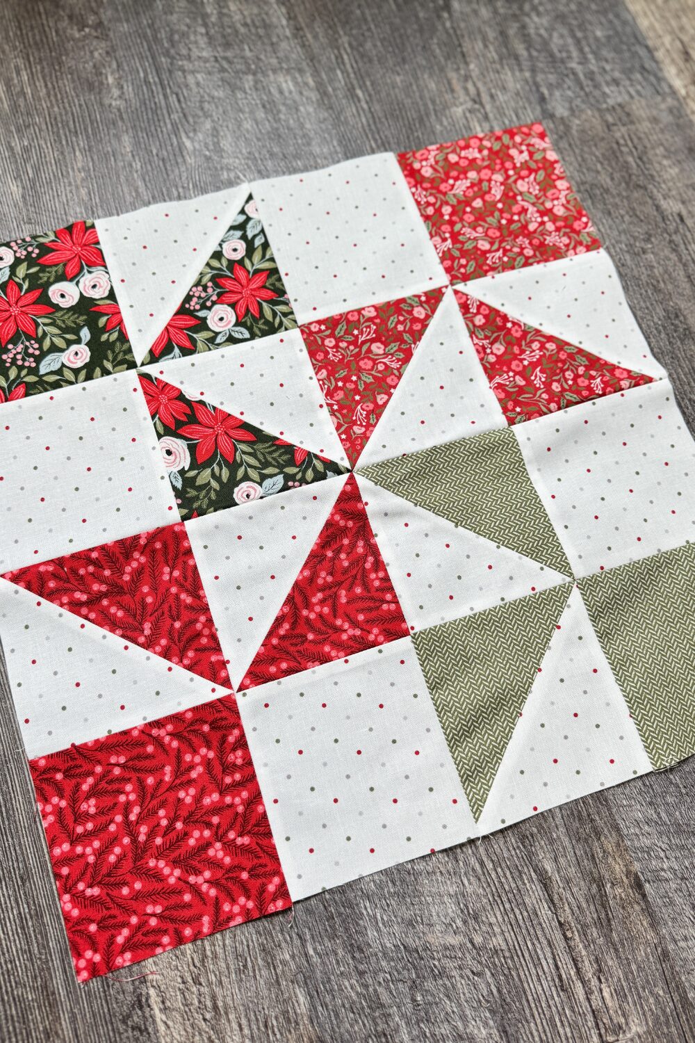 Completed Somersaults block from the Jolly Bar 5 quilt along. Made with half square triangles and square pieces.