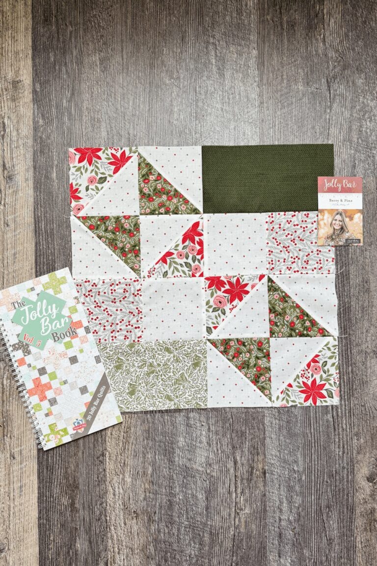 Flat lay of the finished Windflower block with the Jolly Bar Book Vol. 5 in the Jolly Bar 5 Quilt Along.