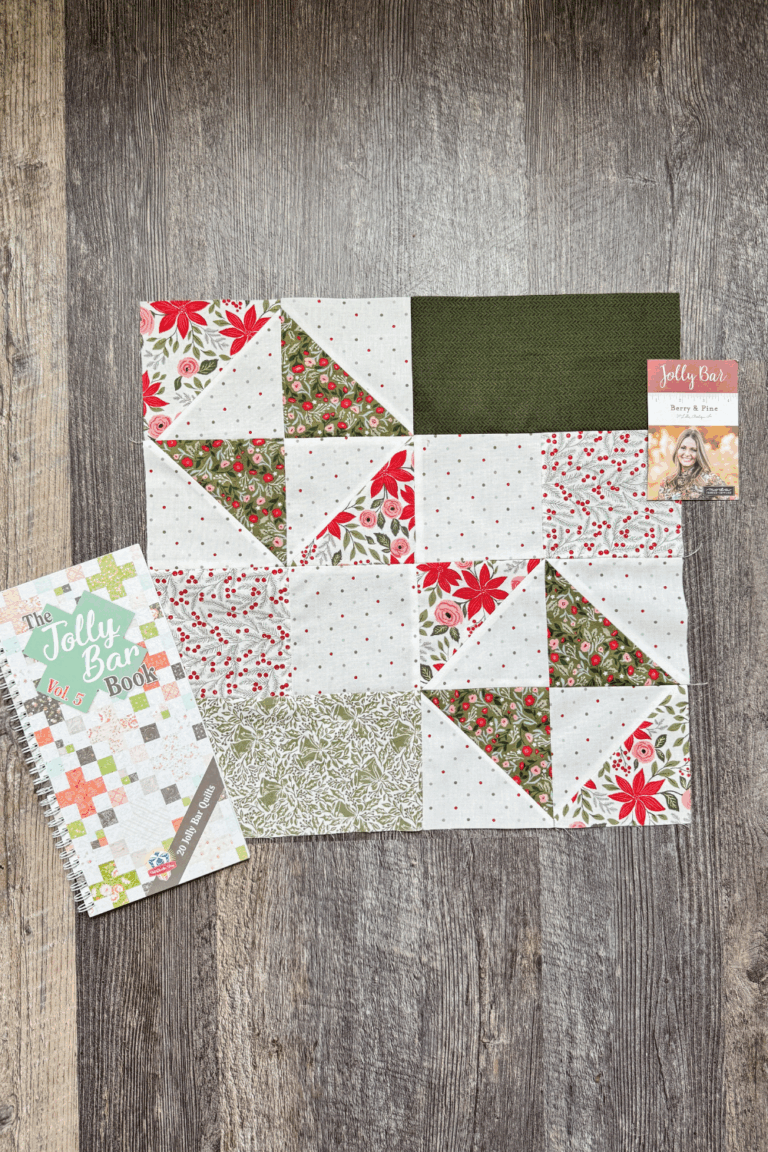 Flat lay of the finished Windflower block with the Jolly Bar Book Vol. 5 in the Jolly Bar 5 Quilt Along.