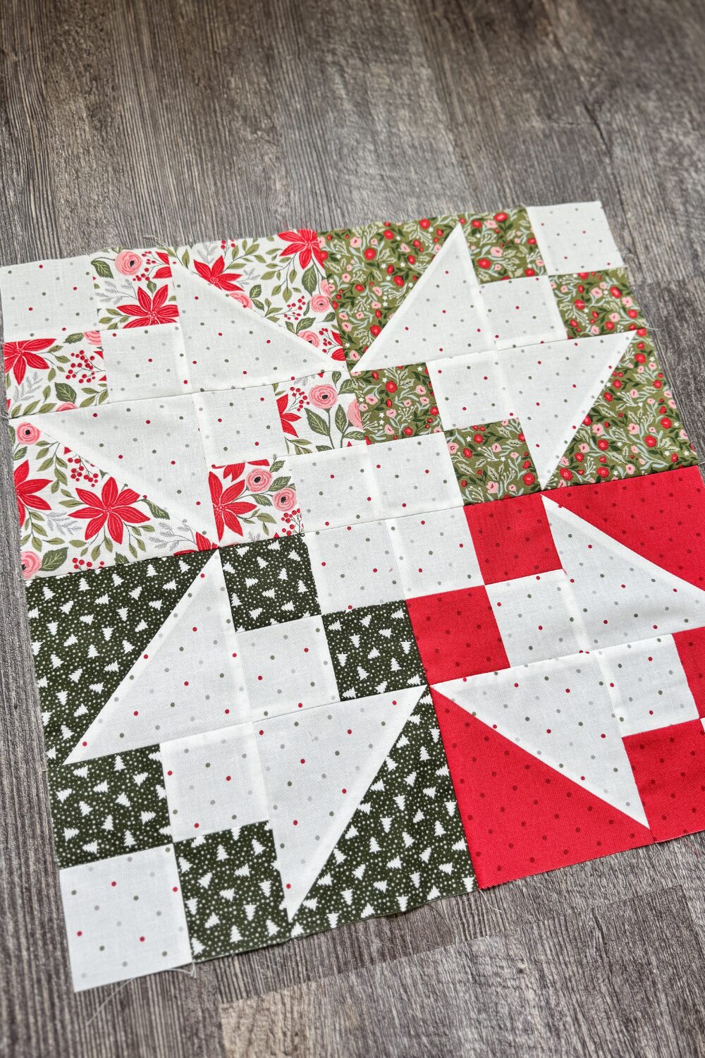 Angled overhead close-up of the finished Variations block showing fabric details and piecing in the Jolly Bar 5 Quilt Along.