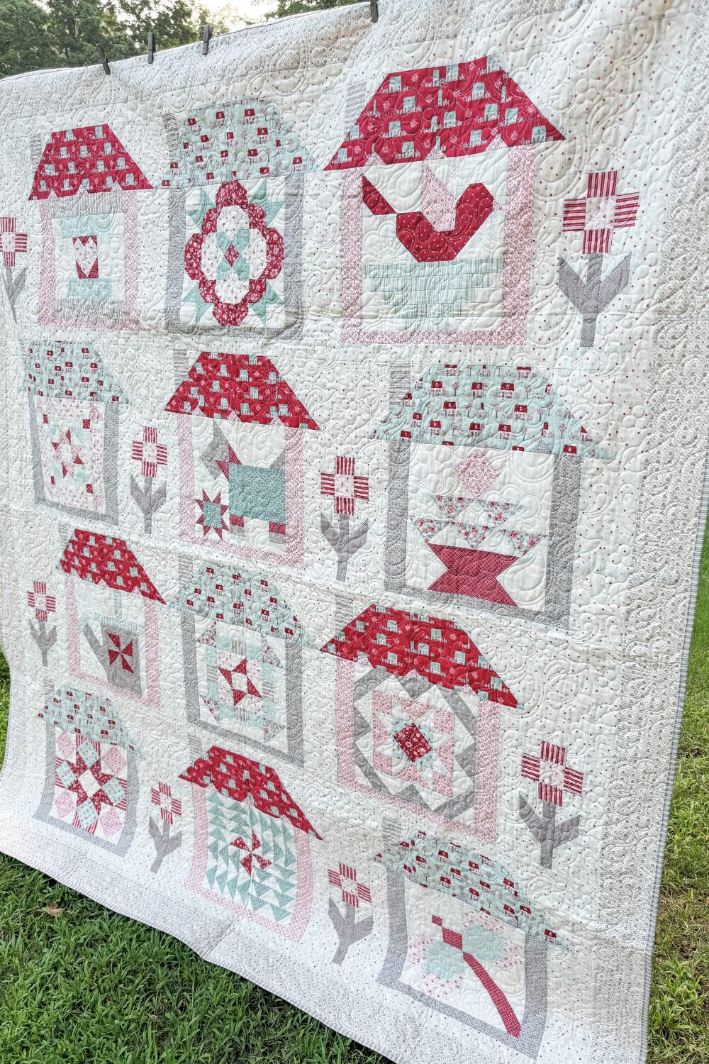 Striped quilt binding neatly attached to the finished Designer Mystery Quilt.