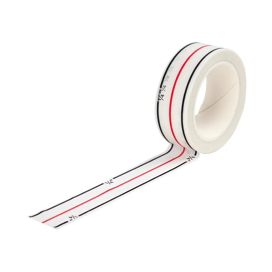 Diagonal Seam Tape by Cluck Cluck Sew is a washi tape with a red center line and two black lines 1/4 inch on either side used for a guide while sewing.
