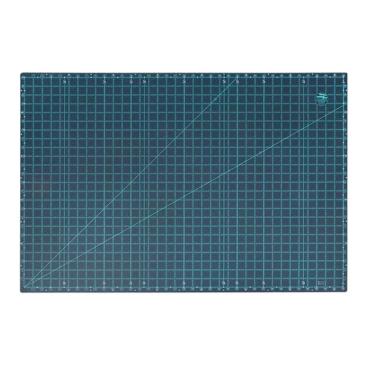 Creative Grids 24 x 36 cutting mat. A grey-blue mat with light blue lines.