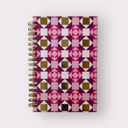 Pink, purple, and gold spiral-bound notebook with Double X quilt pattern, 4x6 inches, hardcover design with 80 lined pages and date headers.