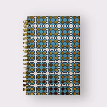 Blue spiral-bound notebook with Joe’s Coat quilt pattern in blue and gold, 4x6 inches, hardcover design with 80 lined pages and date headers.