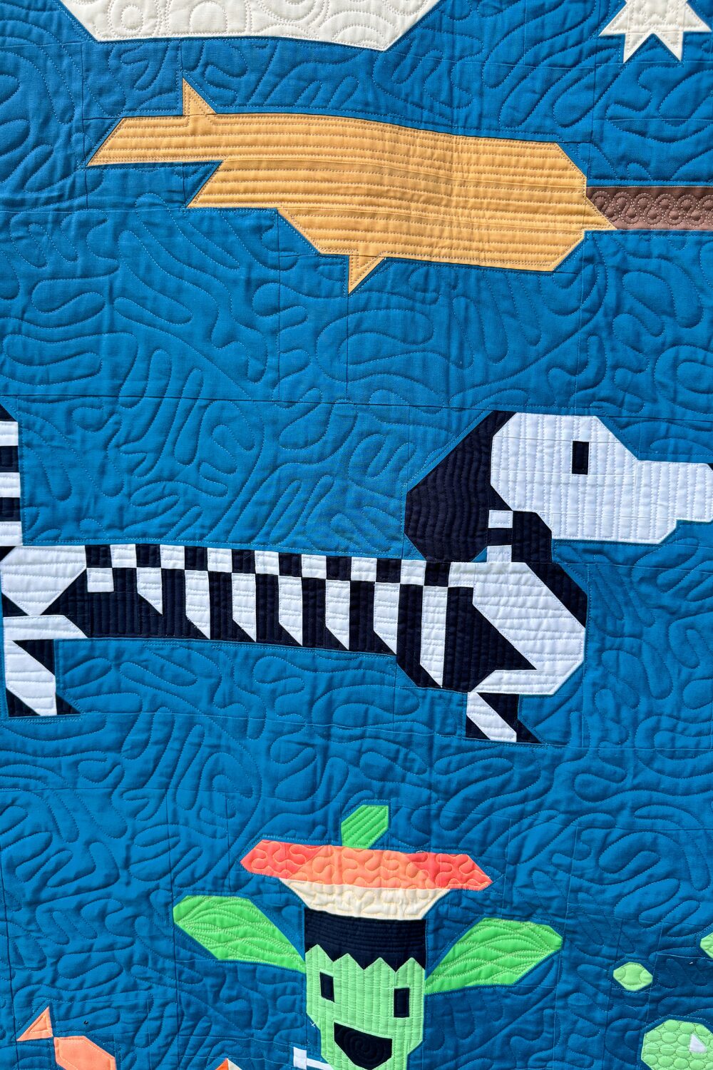 Skeleton weiner dog block from the Halloweenies Quilt showing stitched bone details.