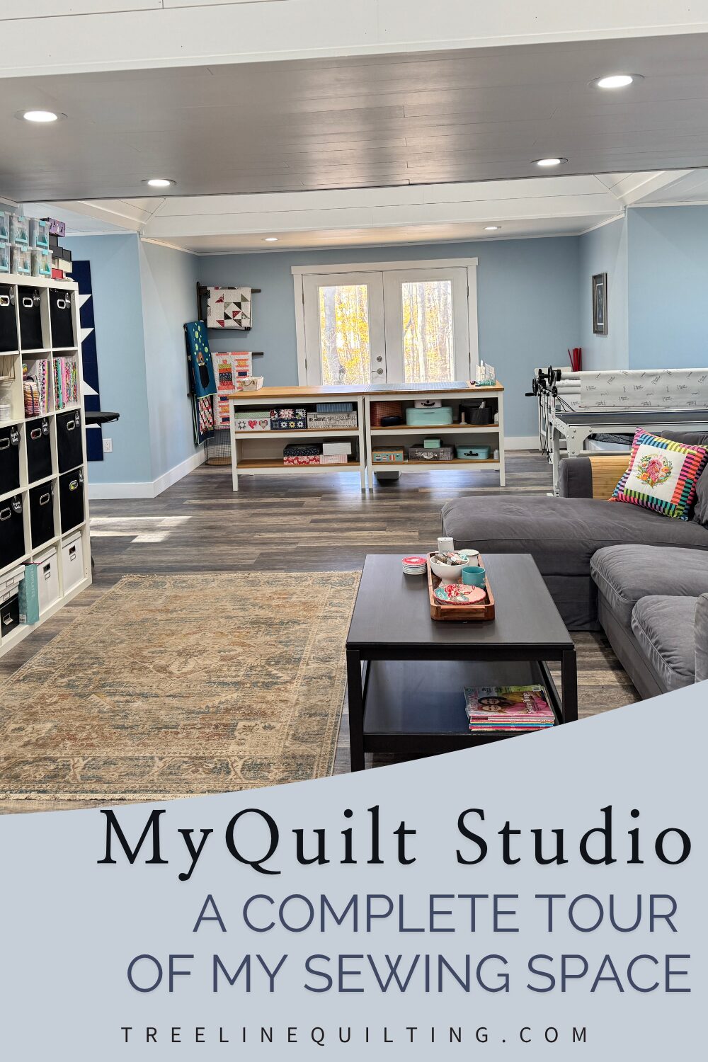 Wide-angle view of a large quilt studio with French doors, multiple dormer work zones, and ample natural light.