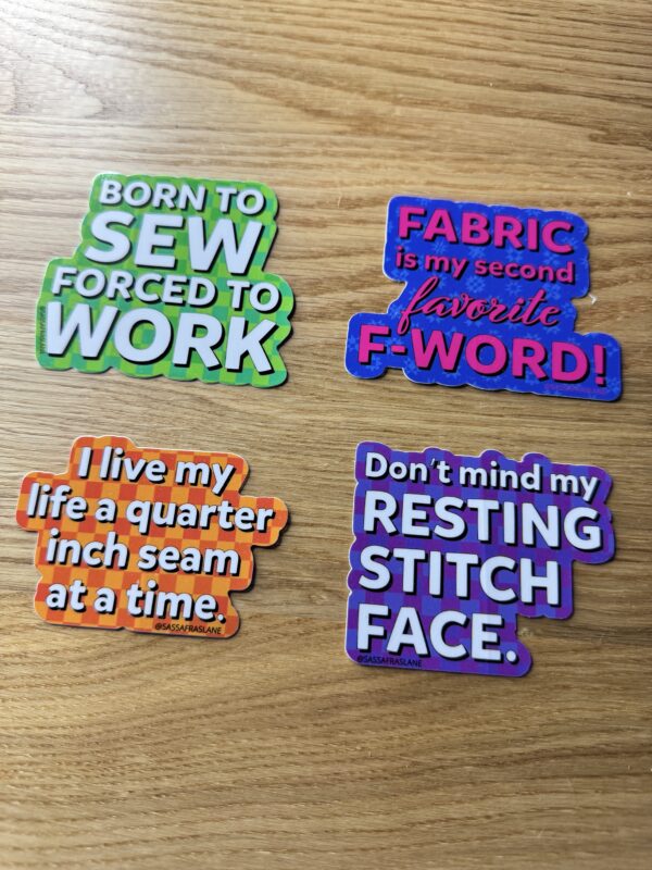 Sassafras Lane Designs Curated Vinyl Sticker Pack, set of 4 sewing-themed vinyl stickers with humorous sayings, waterproof and fade-resistant.