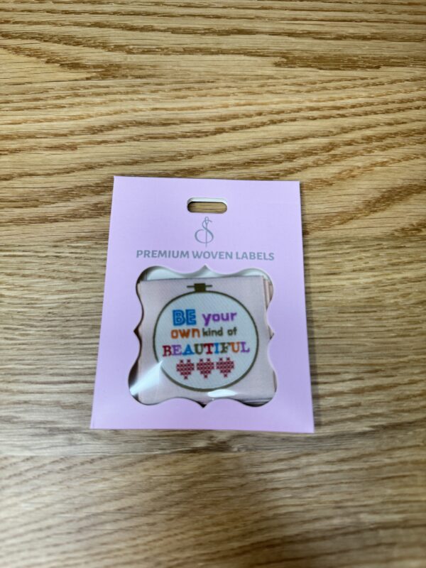 Minki Kim Own Kind Woven Labels, set of 8 hand-drawn polyester labels measuring 1¾" square, perfect for handmade quilts and sewing projects.