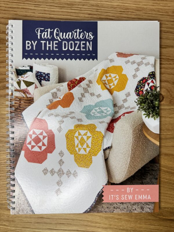Fat Quarters by the Dozen Book by It’s Sew Emma, spiral-bound quilting book featuring 12 quilt patterns using 12 fat quarters each.