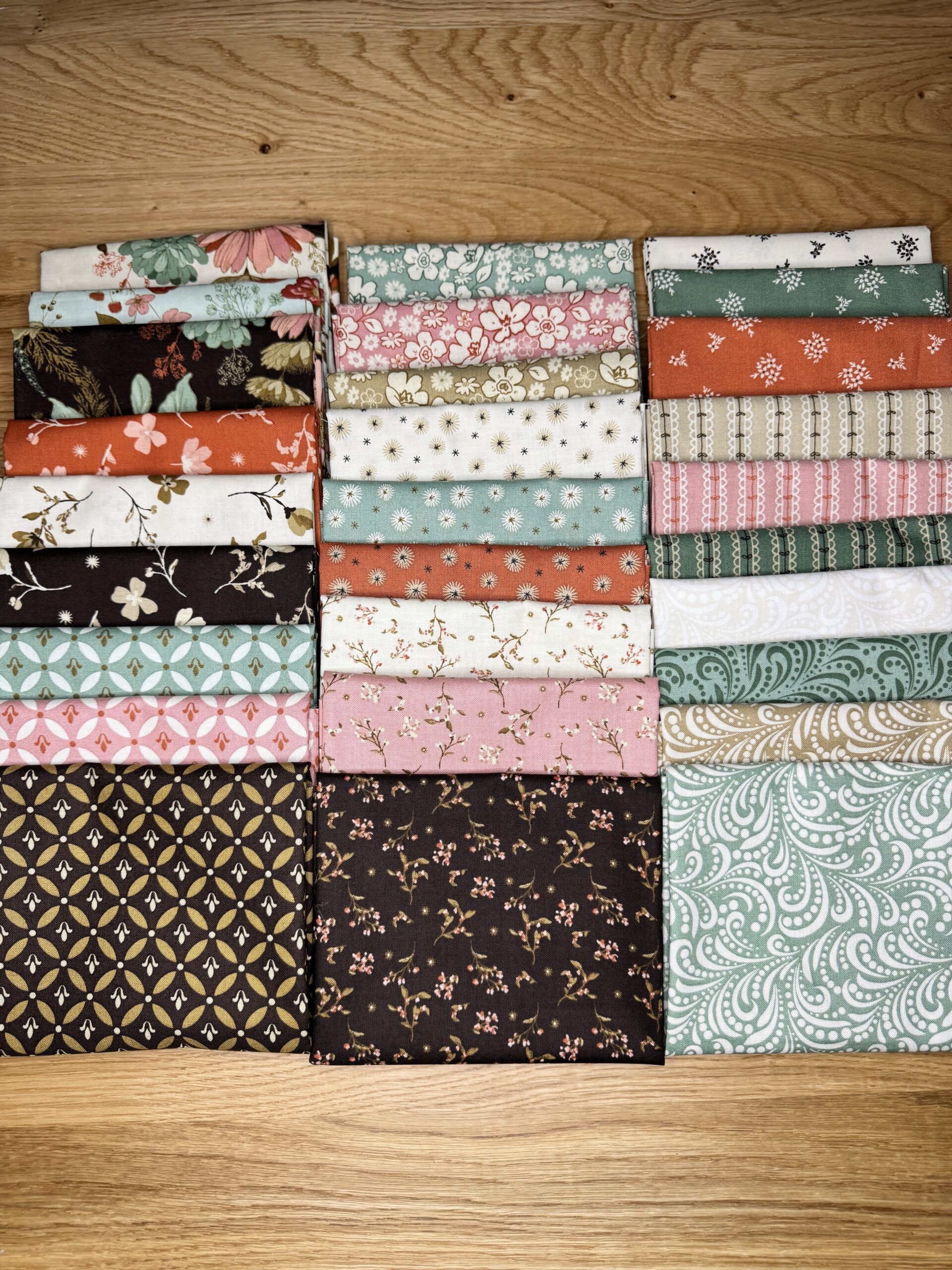 The Morning Latte Fat Quarter Bundle includes 28 fat quarters from the Morning Latte collection by Sandy Gervais for Riley Blake Designs. Each piece measures 18" x 21" and features coordinating prints in espresso, latte, pink, aloe, and spice hues — perfect for quilting and home décor projects.