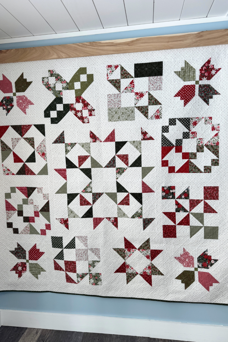 Full view of the finished Jolly Bar 5 sampler quilt made with Berry & Pine fabrics.