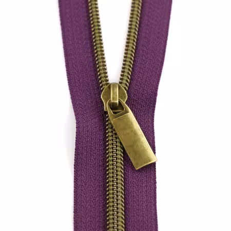 Purple #5 nylon coil zipper by the yard with antique-look teeth and matching zipper pulls from Sallie Tomato.