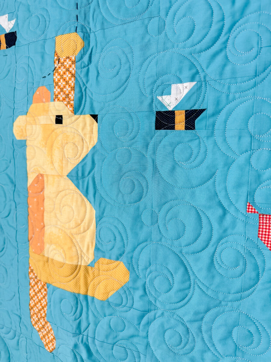 Close-up of Winnie the Pooh quilt block on the smaller quilt.