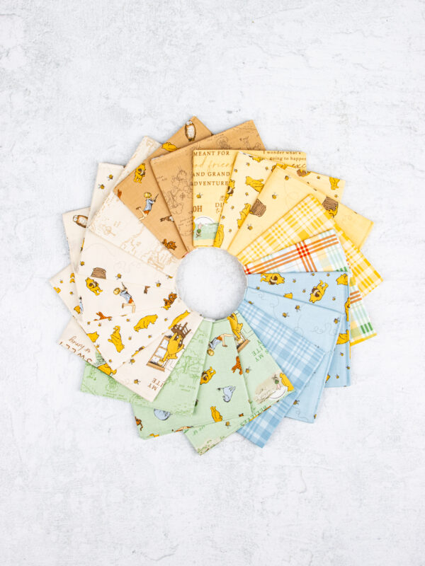 Winnie the Pooh fat quarter bundle featuring 18 coordinating prints by Echo Park for Riley Blake Designs.
