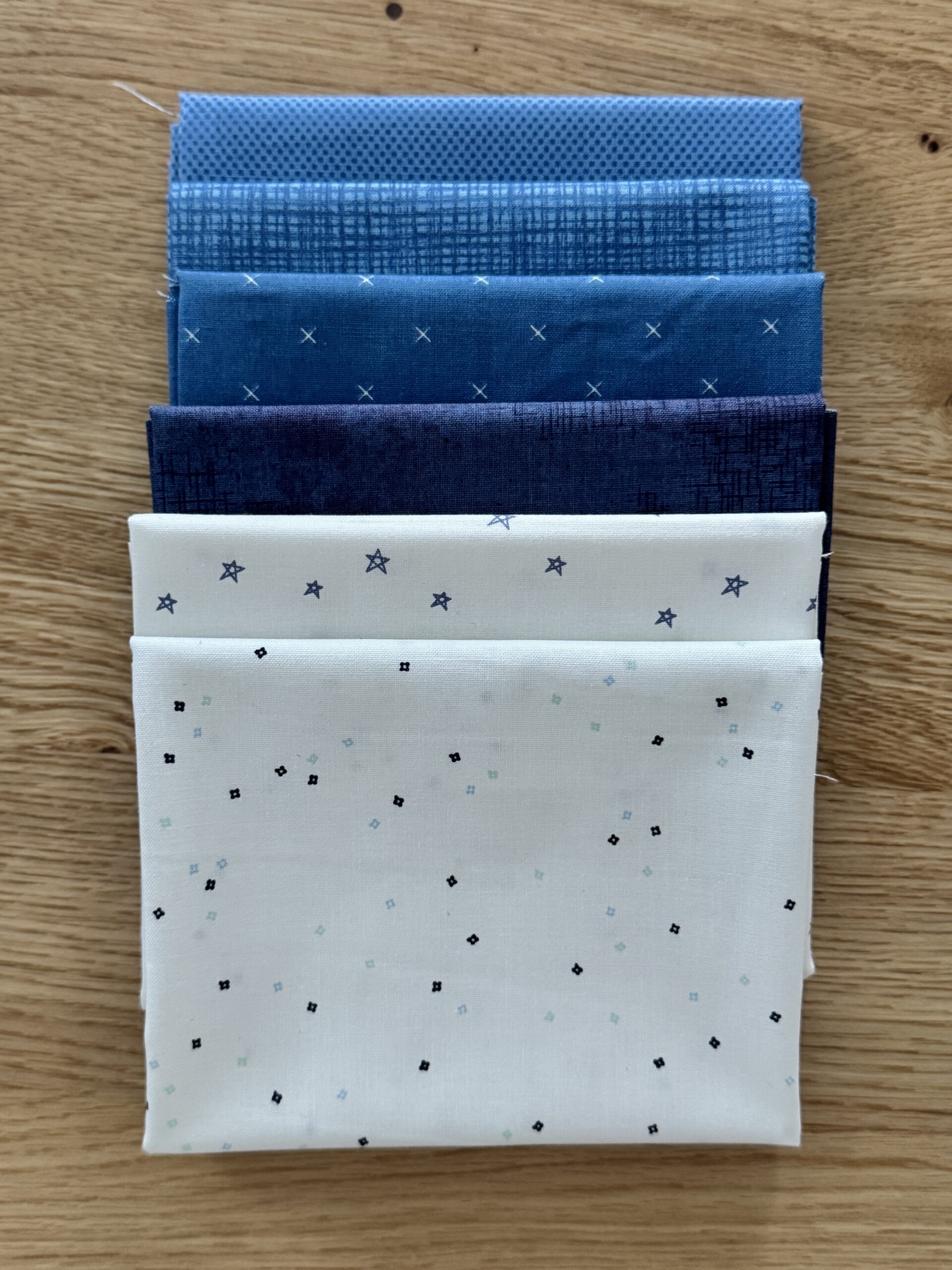 Frost Seasonal Basics Petite fat quarter bundle laid in one row with navy and denim Riley Blake Basics